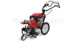 Motozappa Honda FF 500 professionale rossa a frese controrotanti anteriori e grandi ruote scolpite, vista di tre quarti su sfondo bianco.