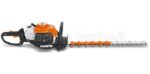 Tagliasiepi a scoppio professionale STIHL HS 82 T per rifinitura, vista laterale su sfondo bianco con lama dentata e impugnatura girevole.