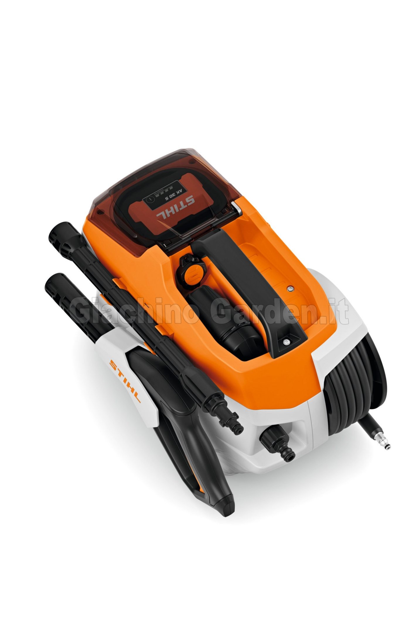 Vista dall'alto dell'idropulitrice STIHL REA 60 PLUS in configurazione compatta con pistola, lancia smontata e tubo bloccati negli alloggiamenti integrati.